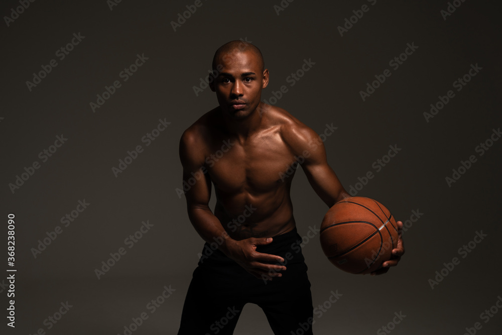 Fitness sports man playing basketball