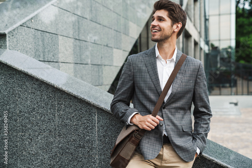 Handsome business man outdoors near business center