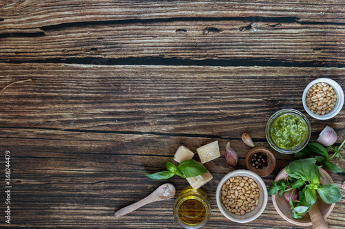 Fototapeta Naklejka Na Ścianę i Meble -  ingredients to cook homemade italian sauce pesto basil, garlic, parmigiano, olive oil and pine nuts horizontale