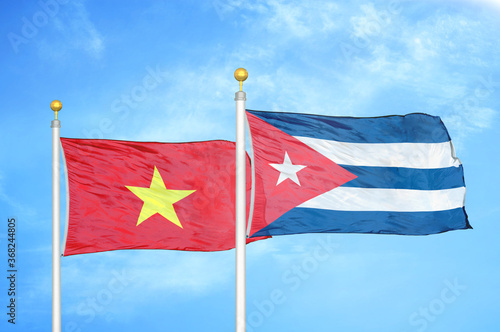 Photography Vietnam and Cuba two flags on flagpoles and blue sky