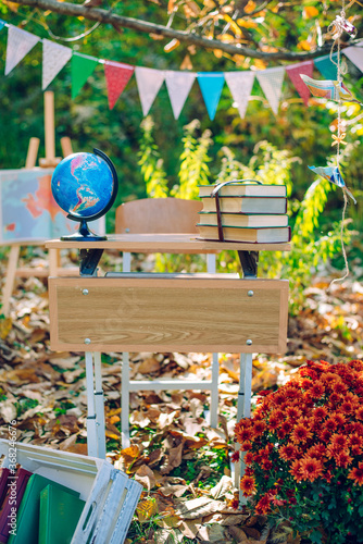 Globe and books on the table in the park