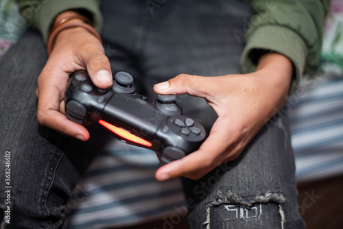 Close up shot of teenager playing video games © rushay