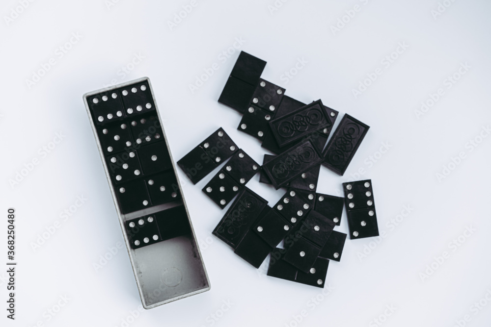 Dominoes lie on a white background Dominoes lie on a white background