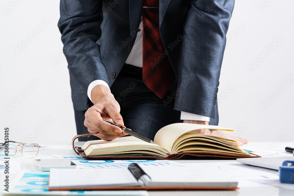 Close-up businessman hand writing to do list Close-up businessman hand writing to do list