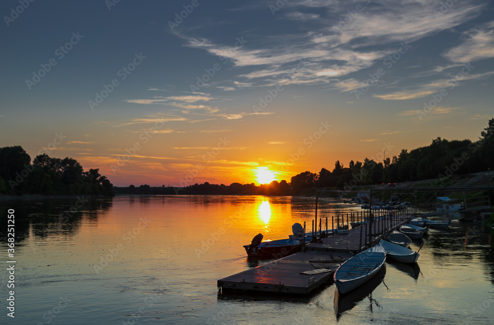 Obraz premium Sunset on Po river, Cremona, Italy.