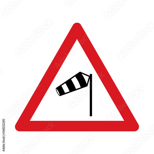 Traffic sign warning for heavy crosswind. Traffic sign isolated on white background. Vector illustration.