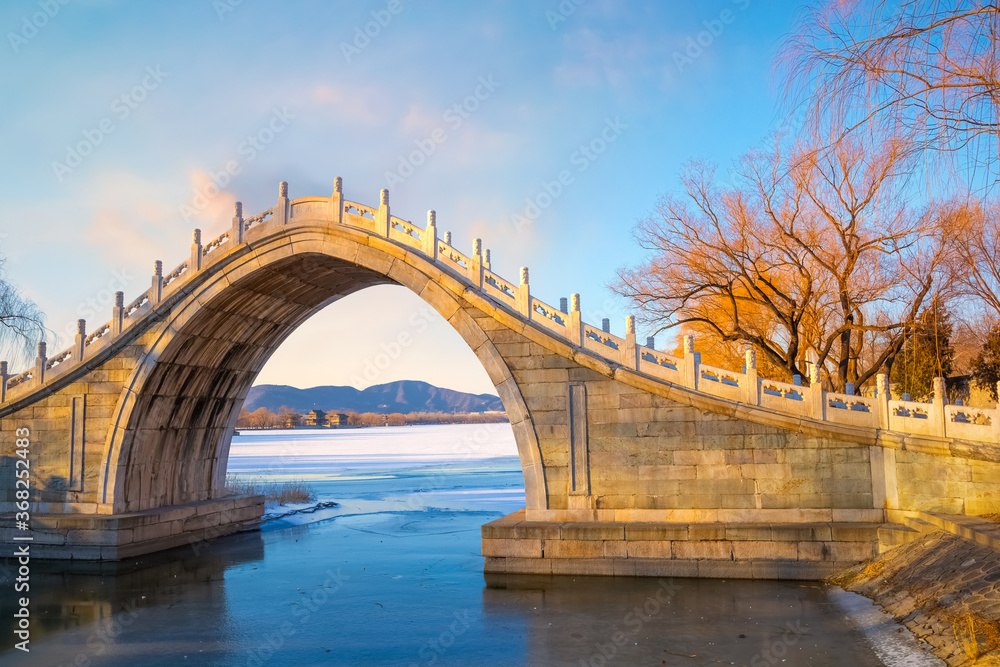 Xiuyi bridge, stands at the largest estuary of Kunming Lake and links the lake with Chang River, feed the flow to the lake and and moats of the Summer Palace