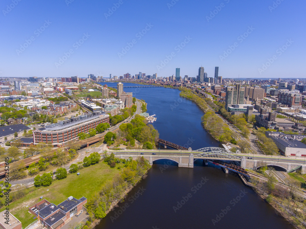 Aerial view of Cambridge on the left and Boston on the right connected by Harvard Bridge from Charles River, Boston, Massachusetts MA, USA. 