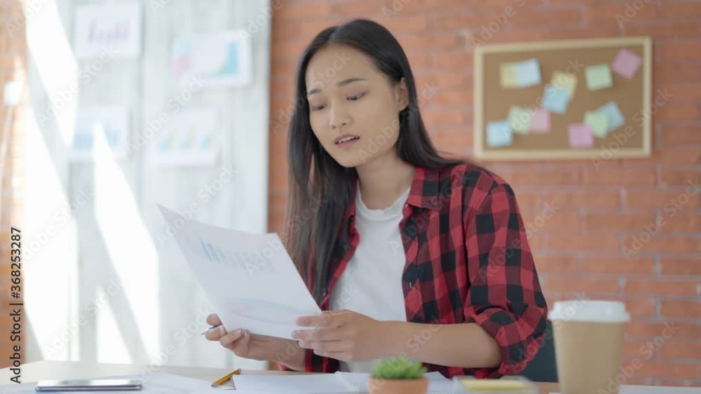 Puzzled girl. Asian student studying graphics and doing homework. 4K