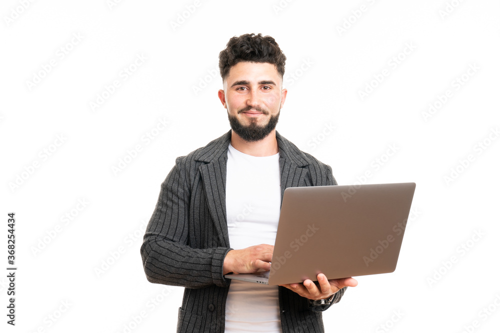 Pleasant positive business man using laptop, isolated over white background Pleasant positive business man using laptop, isolated over white background