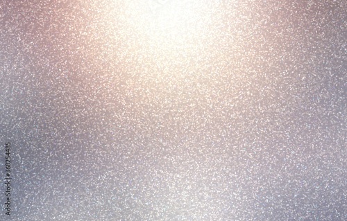 Glow silver shimmer textured background. Shiny metal.