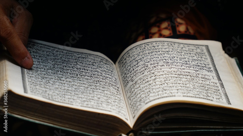 Muslim women read the Quran from a short distance