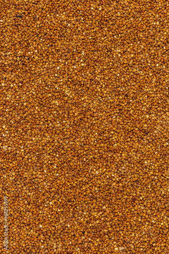 Dry buckwheat grain background