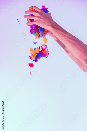 hands with colorful splashes