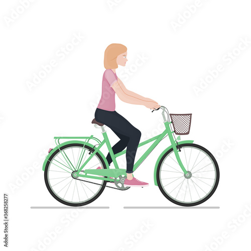 Fototapeta Naklejka Na Ścianę i Meble -  Young girl rides a bike isolated on white background