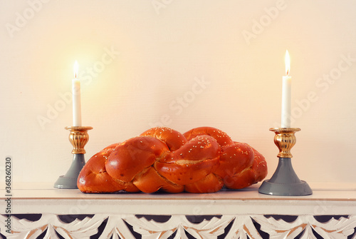 shabbat image. challah bread, shabbat wine and candles photo