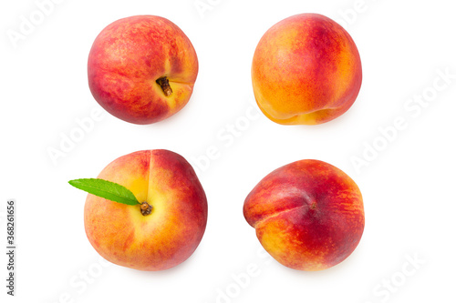 peach fruits with green leaf isolated on white background. top view