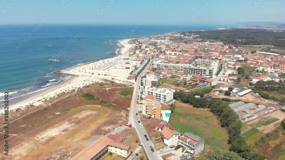 DRONE AERIAL SHOT: Part of the Litoral de Esposende Protected Landscape, Apulia Beach covers a large expanse of sand surrounded by dunes that serve to protect the Beach from stronger winds, Portugal. DRONE AERIAL SHOT: Part of the Litoral de Esposende Protected Landscape, Apulia Beach covers a large expanse of sand surrounded by dunes that serve to protect the Beach from stronger winds, Portugal.