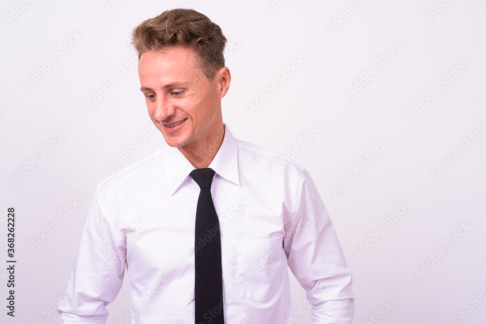Portrait of happy handsome businessman with blond curly hair Portrait of happy handsome businessman with blond curly hair