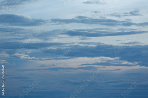 Blue sky background with tiny clouds.