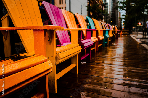 View of colorful chairs on a rainy day in Canada
