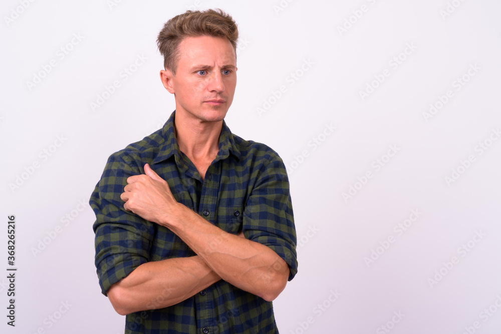 Handsome man with blond curly hair against white background Handsome man with blond curly hair against white background