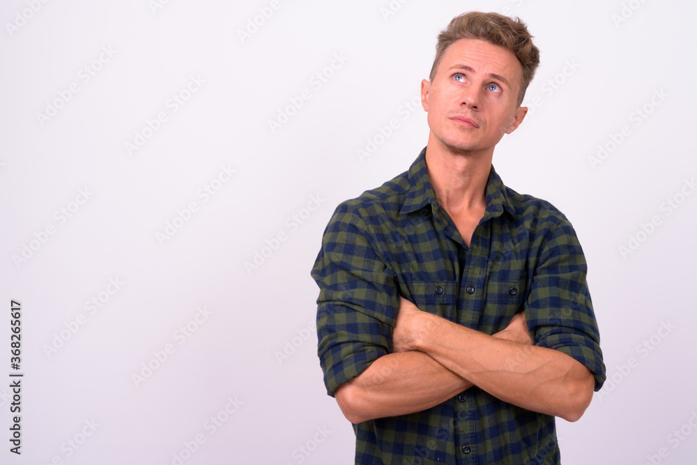 Handsome man with blond curly hair against white background Handsome man with blond curly hair against white background