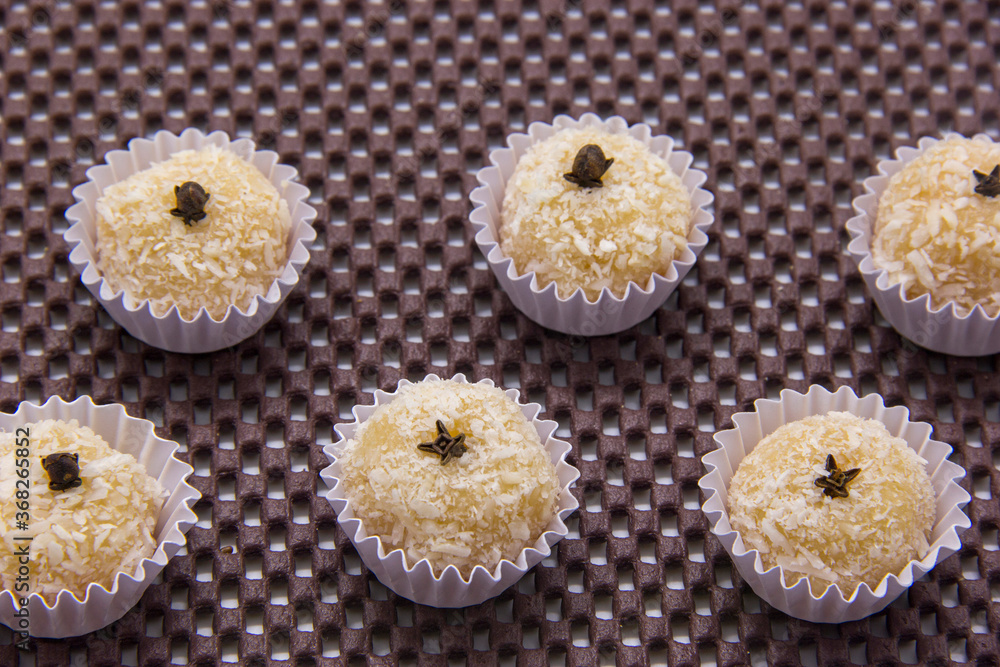 Traditional Brazilian sweet with grated coconut. Beijinho. Traditional Brazilian sweet with grated coconut. Beijinho.