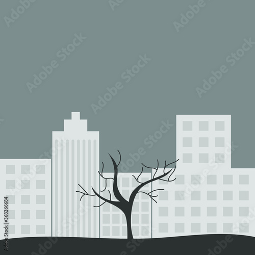 Tree without leaves on a background of the city