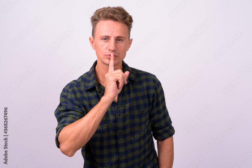 Handsome man with blond curly hair against white background Handsome man with blond curly hair against white background