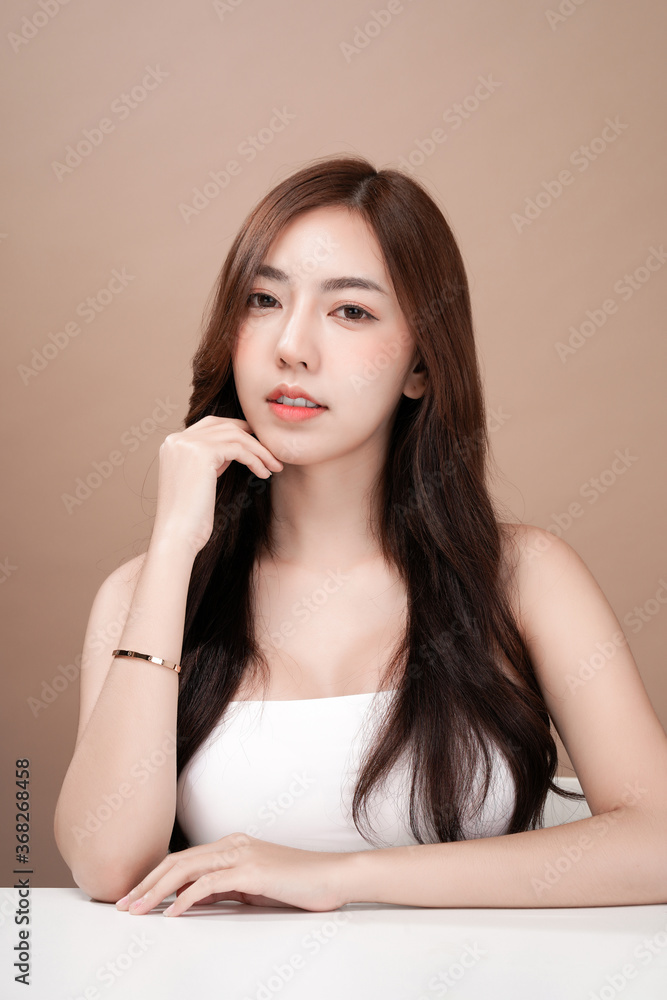Asian beauty woman with natural makeup, cosmetic and plastic surgery concept, Isolated mocha brown background Asian beauty woman with natural makeup, cosmetic and plastic surgery concept, Isolated mocha brown background
