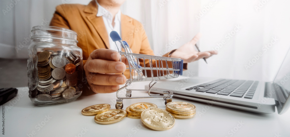 Business people use tablets and hold credit cards as an online shopping concept With a calculator and a book placed on the table