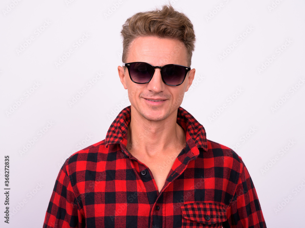 Portrait of happy handsome hipster man with blond curly hair Portrait of happy handsome hipster man with blond curly hair
