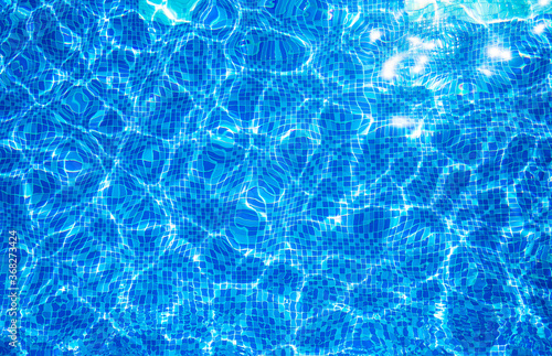 Top view blue ripped water in swimming pool with texture and refraction