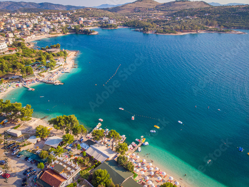 Fototapeta Naklejka Na Ścianę i Meble -  Aerial view of the coastline of the resort town of Ksamil on a sunny summer day. Albania.