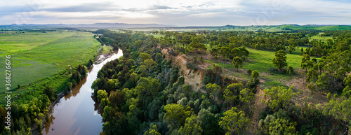 Sunflare light over cliff and Hunter River landscape near Singleton