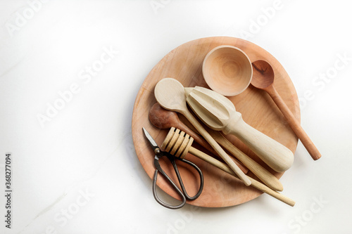 Collection of wooden kitchen utensils photo