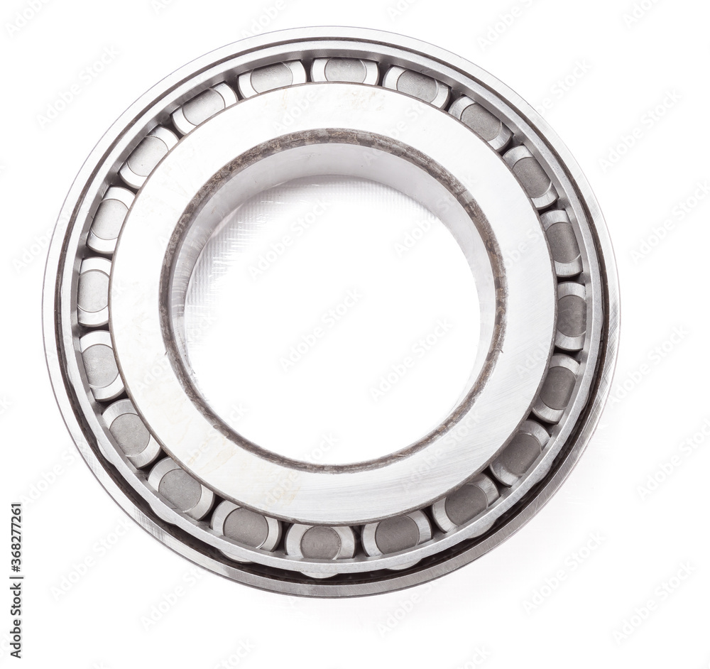Shiny metal single row round roller bearing designed to absorb radial and one-sided axial loads of the vehicle. Sale of spare parts or repair in a workshop or car service. Shiny metal single row round roller bearing designed to absorb radial and one-sided axial loads of the vehicle. Sale of spare parts or repair in a workshop or car service.