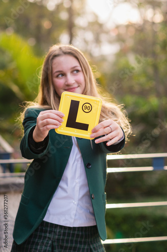 learner driver holding L plate photo