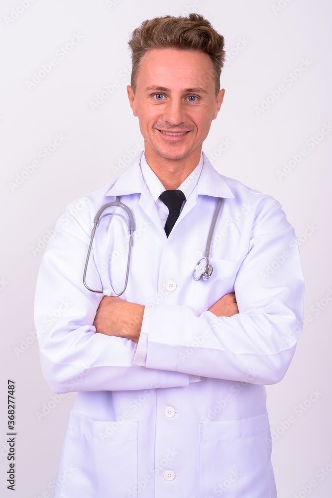 Portrait of happy handsome man doctor with blond curly hair Portrait of happy handsome man doctor with blond curly hair