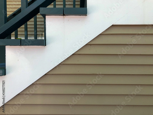 Tableau sur toile green wooden stairs on exterior of building
