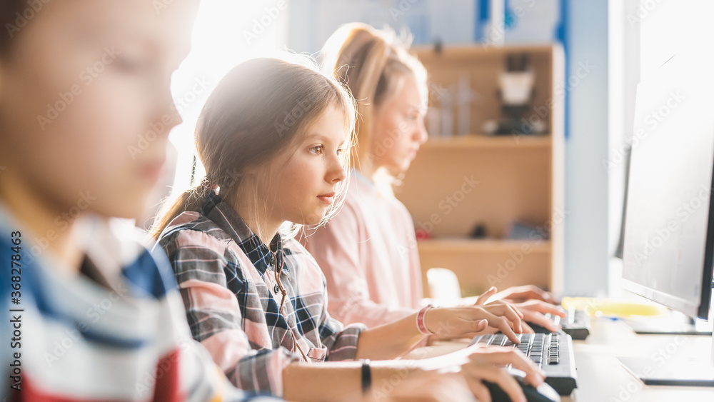 Elementary School Classroom: Smart Girl is Uses Personal Computer ...