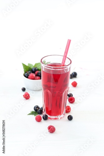 Wallpaper Mural Berry drink, compote of fresh raspberries and black currants in a glass on a white background Torontodigital.ca