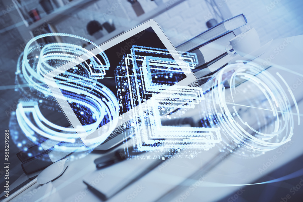 Multi exposure of table with computer and seo drawing hologram. Search optimization concept. Multi exposure of table with computer and seo drawing hologram. Search optimization concept.