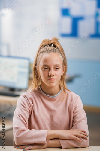 Elementary School Classroom: Portrait of a Cute Little Girl with Blonde Hair and Ponytail Follows Class Rules and Sits Correctly. Brilliant Young Student Free Download Elementary School Classroom: Portrait of a Cute Little Girl with Blonde Hair and Ponytail Follows Class Rules and Sits Correctly. Brilliant Young Student - GFXLoad