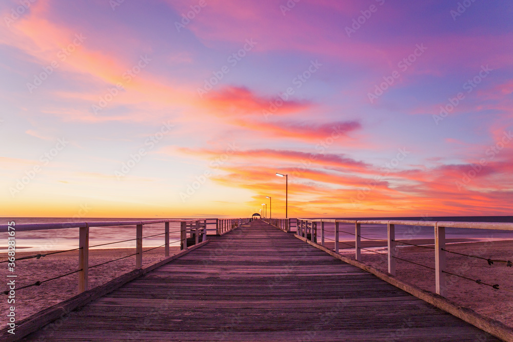 Looking along a jetty at sunset Looking along a jetty at sunset