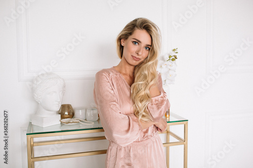 blonde girl in a pink dress