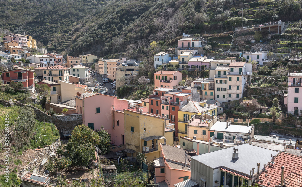 Riomaggiore village, first & most southern of Cinque Terre coastal villages, located in a small & narrow uphill valley, as seen from north to south, La Spezia, Liguria region, Italy.