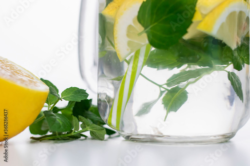  Drink with lemon, mint and ice. All this on a white background