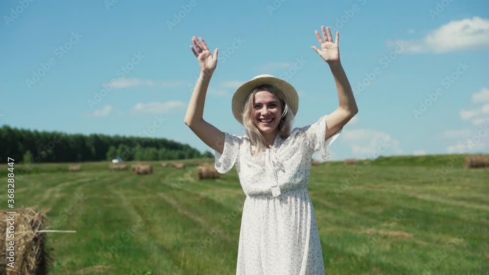 The girl is happy and waving her arms from happiness. The girl is happy and waving her arms from happiness.